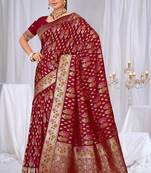 Dusty mauve raw silk saree with zari and floral thread work with tassels