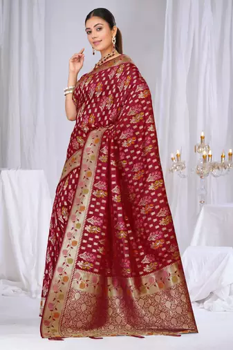 Dusty mauve raw silk saree with zari and floral thread work with tassels