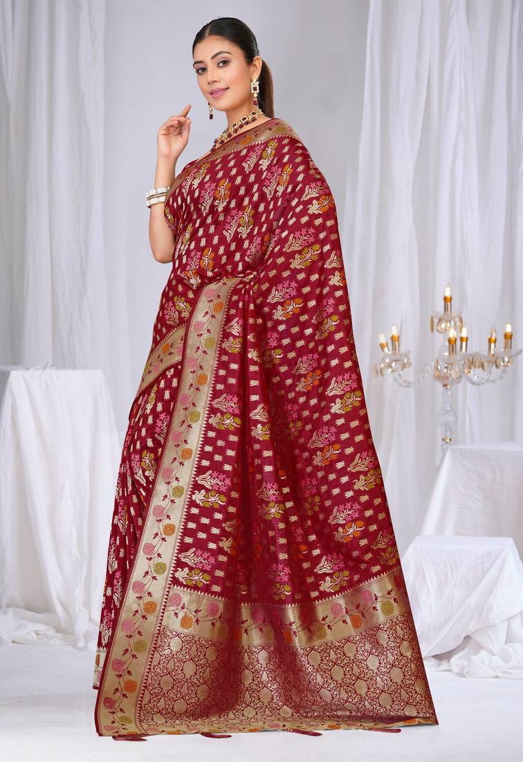Dusty mauve raw silk saree with zari and floral thread work with tassels