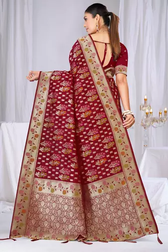 Dusty mauve raw silk saree with zari and floral thread work with tassels