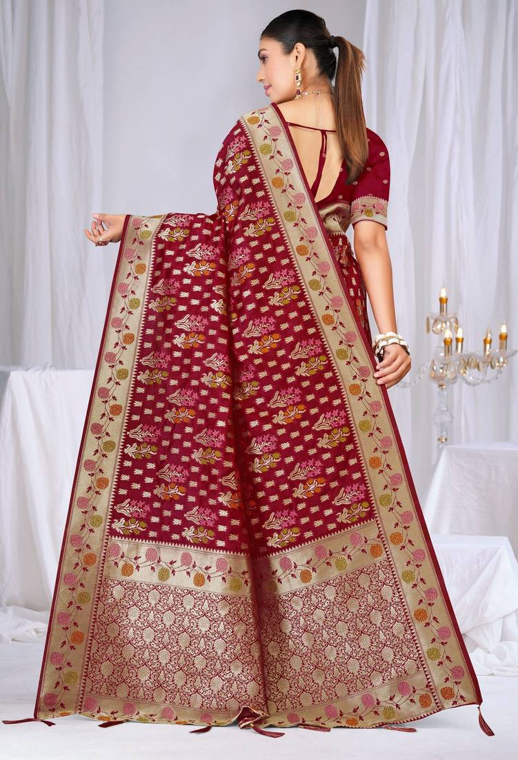 Dusty mauve raw silk saree with zari and floral thread work with tassels