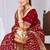 Dusty mauve raw silk saree with zari and floral thread work with tassels