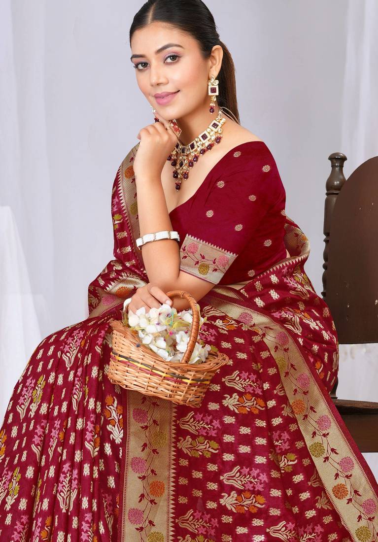 Dusty mauve raw silk saree with zari and floral thread work with tassels