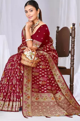 Dusty mauve raw silk saree with zari and floral thread work with tassels