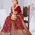Dusty mauve raw silk saree with zari and floral thread work with tassels