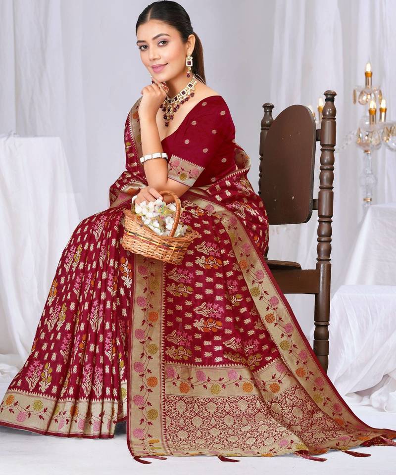 Dusty mauve raw silk saree with zari and floral thread work with tassels