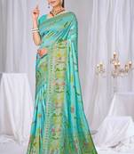 Sky blue faux georgette saree with zari and thread work with tassels