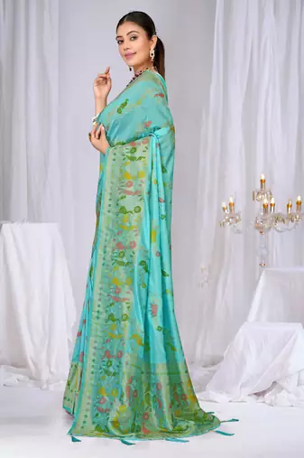 Sky blue faux georgette saree with zari and thread work with tassels