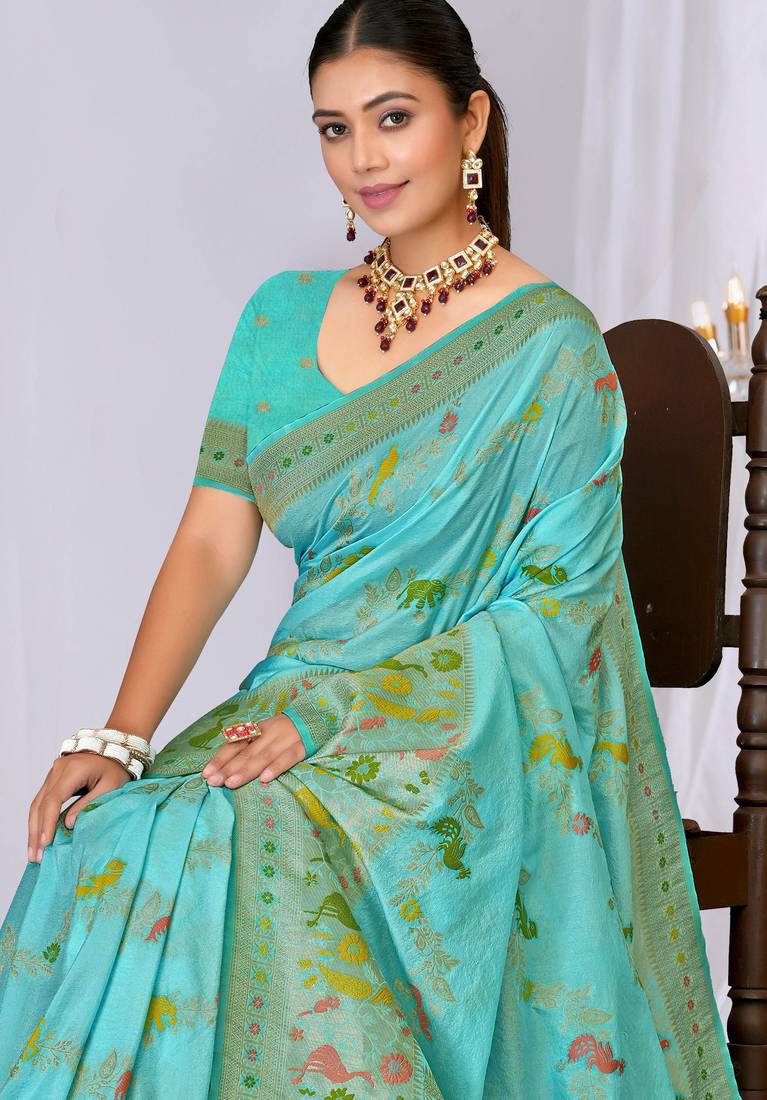 Sky blue faux georgette saree with zari and thread work with tassels