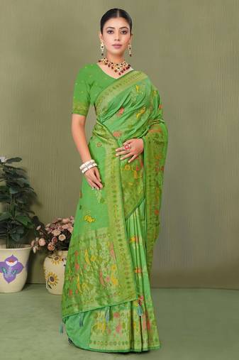 Light green faux georgette saree with zari and thread work with tassels