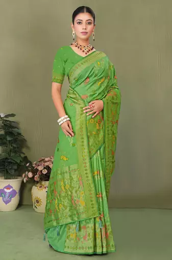Light green faux georgette saree with zari and thread work with tassels