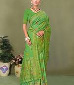Light green faux georgette saree with zari and thread work with tassels