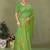 Light green faux georgette saree with zari and thread work with tassels