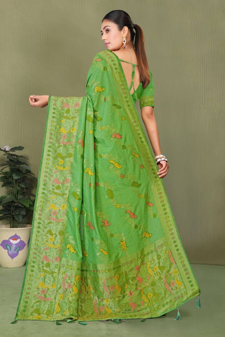 Light green faux georgette saree with zari and thread work with tassels