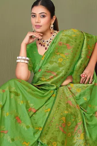 Light green faux georgette saree with zari and thread work with tassels