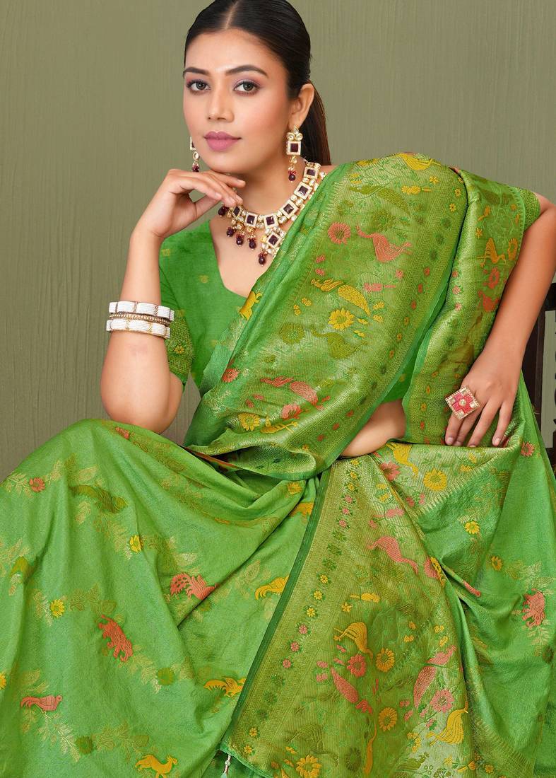 Light green faux georgette saree with zari and thread work with tassels