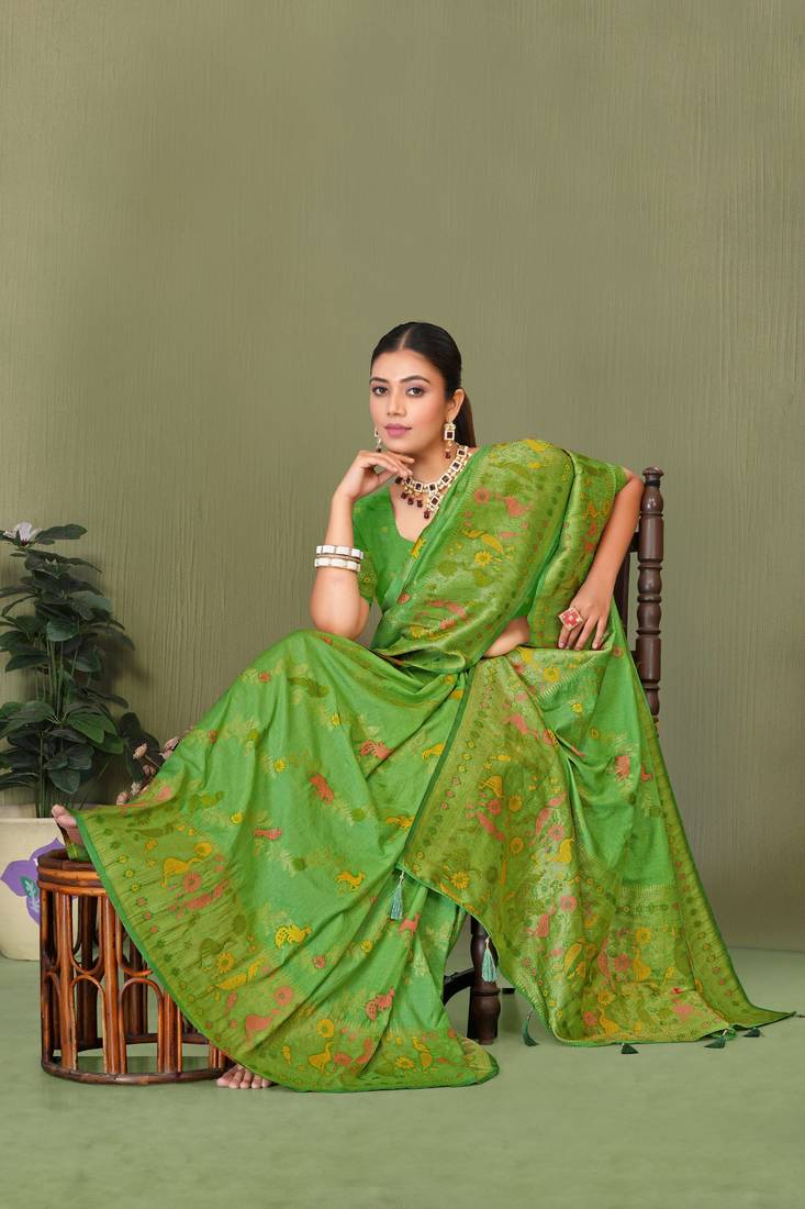 Light green faux georgette saree with zari and thread work with tassels