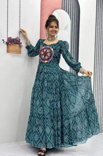 Navratri wear green bandhni printed gamathi & mirror work long flared gown