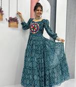 Navratri wear green color bandhni printed gamathi & mirror work long flared gown full stitched.