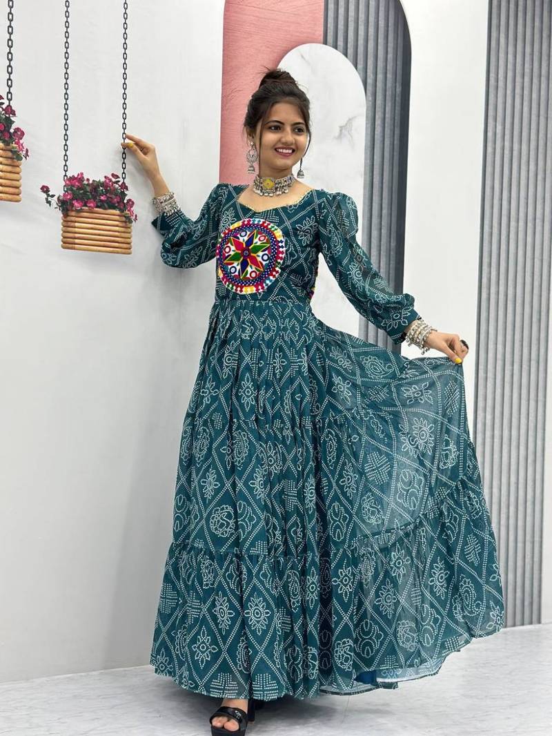 Navratri wear green color bandhni printed gamathi & mirror work long flared gown full stitched.