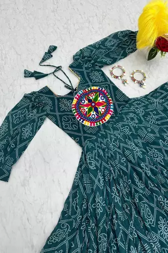 Navratri wear green bandhni printed gamathi & mirror work long flared gown