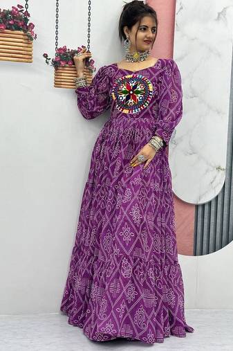 Navratri wear purple color bandhni printed gamathi & mirror work long flared gown full stitched.
