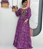 Navratri wear purple color bandhni printed gamathi & mirror work long flared gown full stitched.