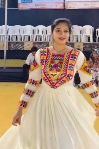 Navratri wear off-white color fiyona silk gamthi & mirror work gown full stitched.