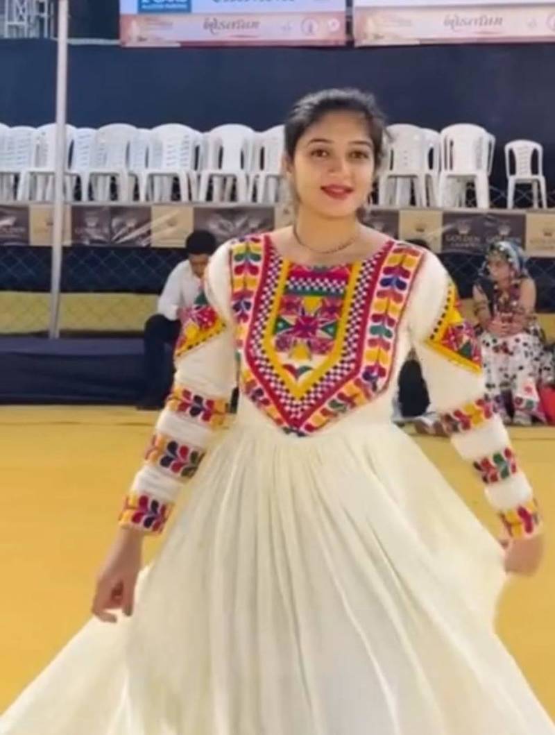 Navratri wear off-white color fiyona silk gamthi & mirror work gown full stitched.