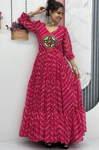 Navratri wear pink color bandhni printed gamathi & mirror work long flared gown full stitched.
