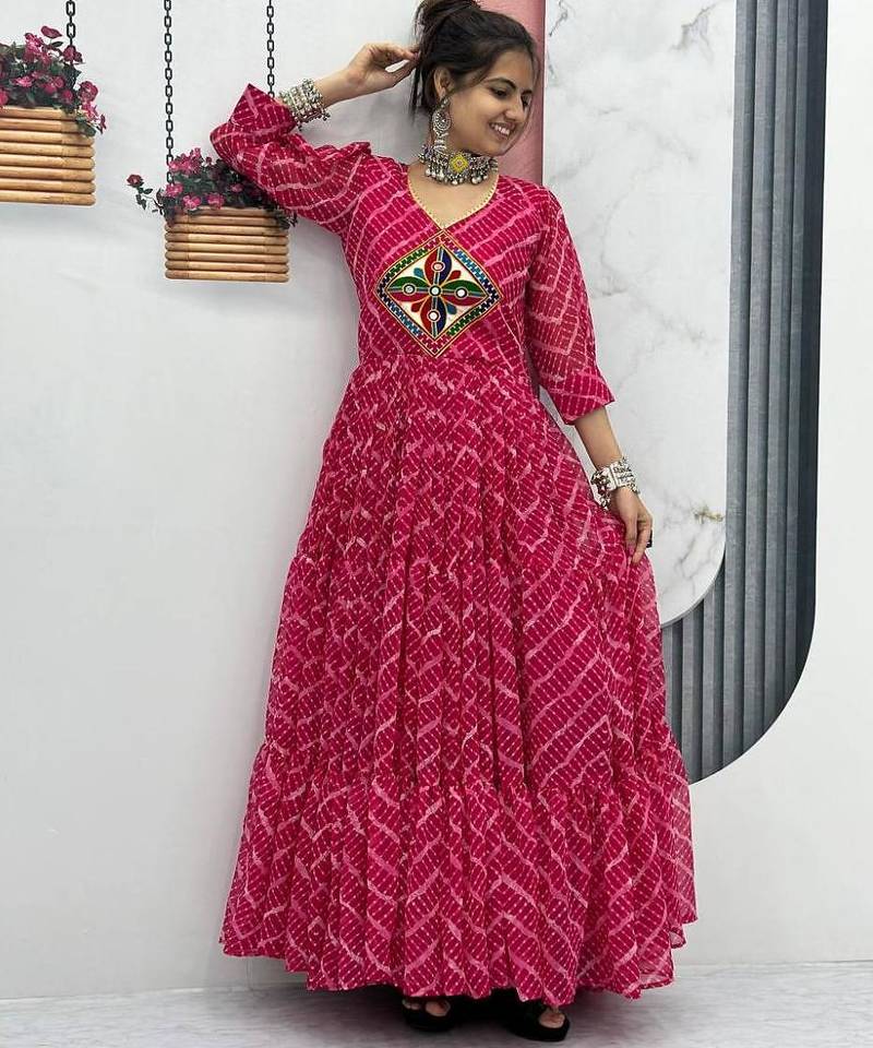 Navratri wear pink color bandhni printed gamathi & mirror work long flared gown full stitched.