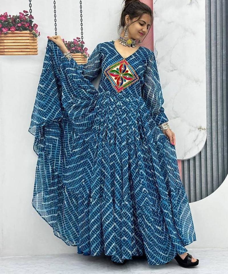 Navratri wear rama blue color bandhni printed gamathi & mirror work long flared gown full stitched.