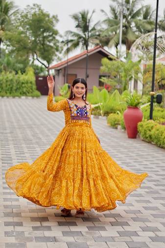 Navratri wear yellow georgette bandhni printed thread embroidered mirror -codi lace work gown