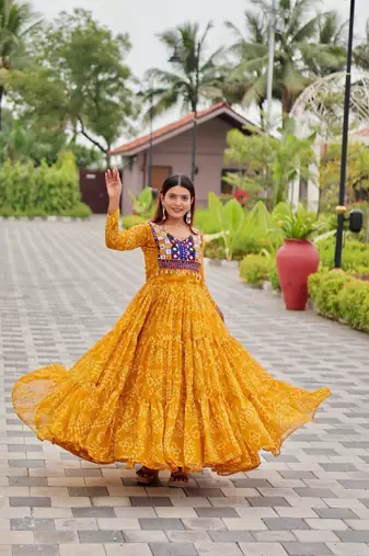 Navratri wear yellow georgette bandhni printed thread embroidered mirror -codi lace work gown
