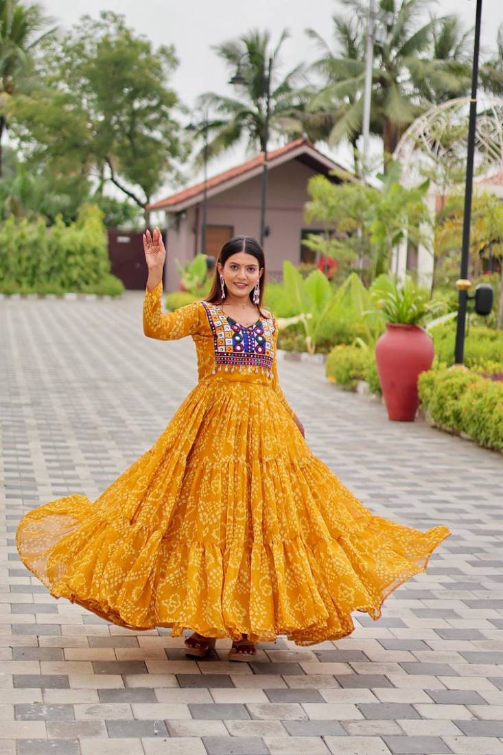 Navratri wear yellow color georgette bandhni printed thread embroidered mirror -codi lace work gown full stitched
