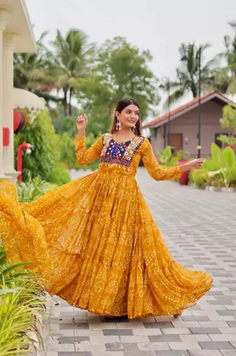 Navratri wear yellow georgette bandhni printed thread embroidered mirror -codi lace work gown