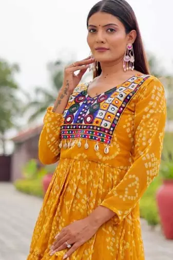 Navratri wear yellow georgette bandhni printed thread embroidered mirror -codi lace work gown