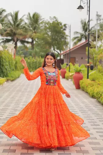 Navratri wear orange georgette bandhni printed thread embroidered mirror work gown