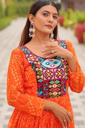 Navratri wear orange georgette bandhni printed thread embroidered mirror work gown