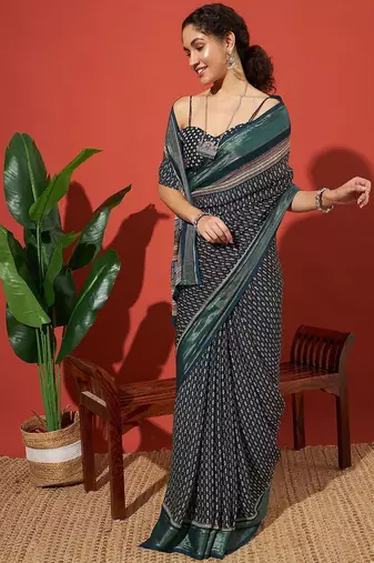 Teal elegant printed georgette saree with blouse piece
