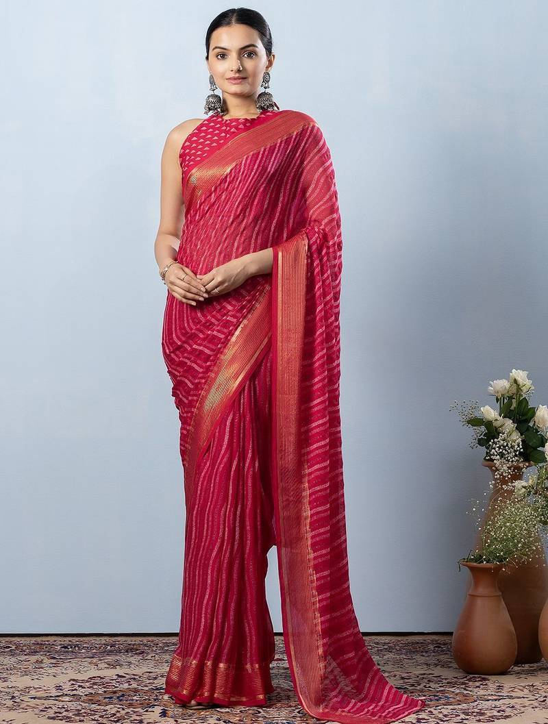 Pink elegant printed georgette saree with blouse piece