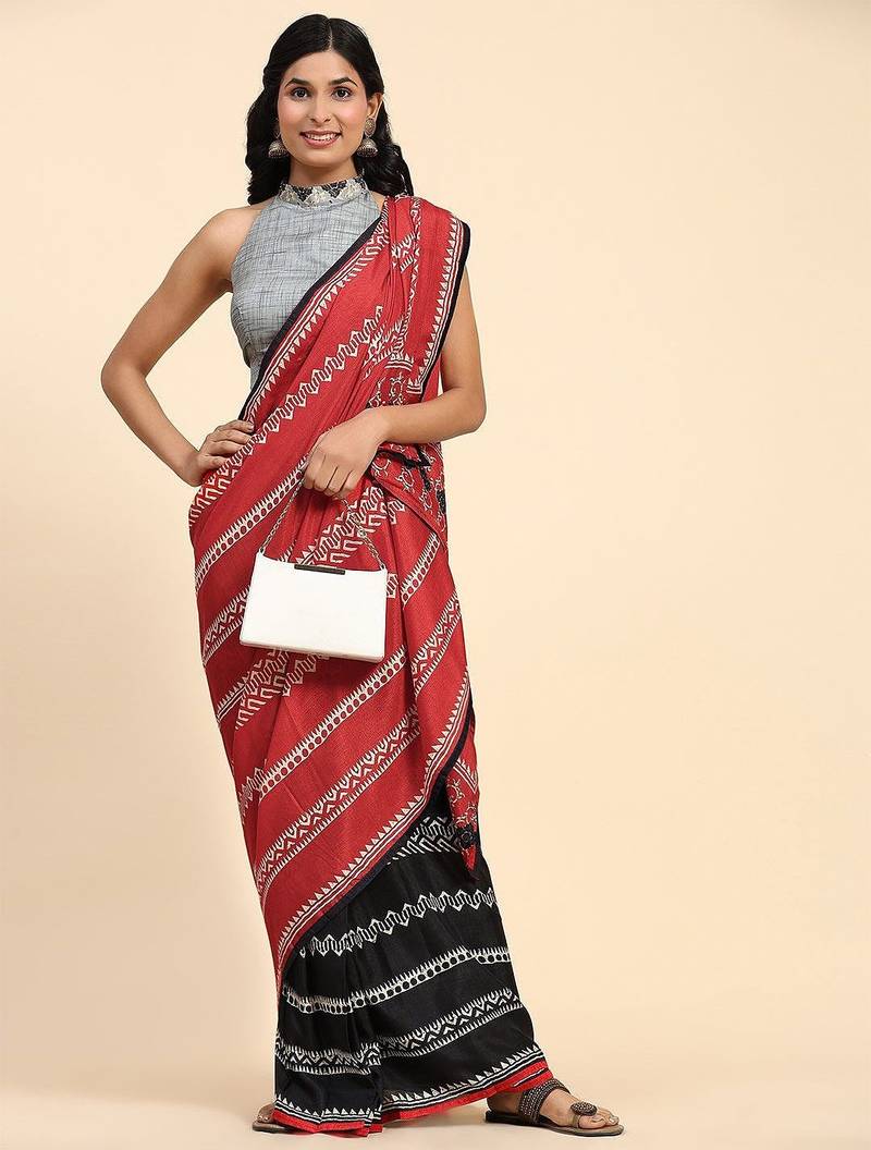 Red printed silk blend ethnic saree with blouse piece