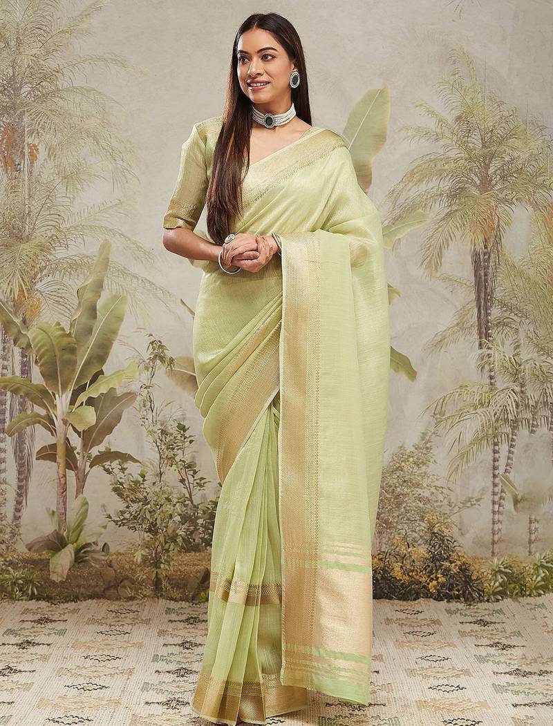 Green elegant zari woven linen saree with blouse piece