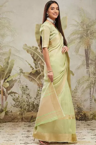 Green elegant zari woven linen saree with blouse piece