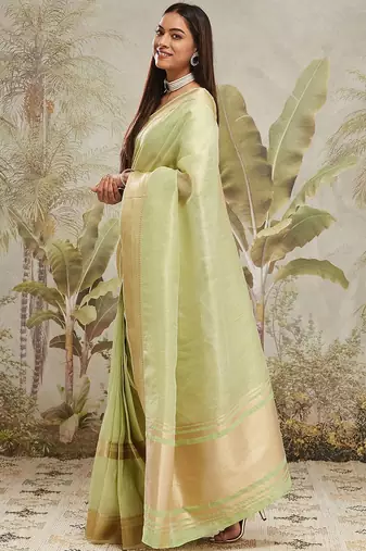 Green elegant zari woven linen saree with blouse piece