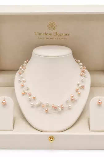 Floating freshwater pearl necklace and earring set, multi-strand, white and peach, with silver clasp