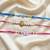 Multi color set of 3 thread rakhis stylish design