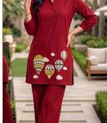 Trendy solid red cotton kurta with hot air balloon embroidery and matching trousers
