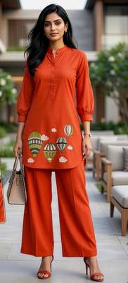  solid orange cotton kurta with hot air balloon embroidery and matching trousers 1