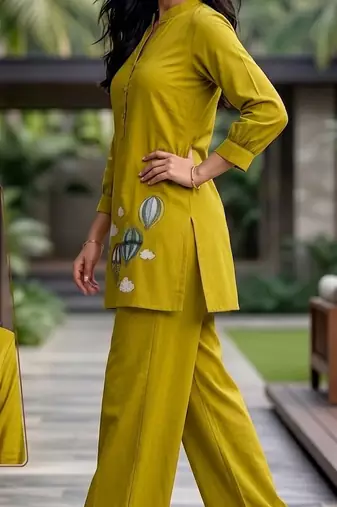 Trendy solid olive green cotton kurta with hot air balloon embroidery and matching trousers